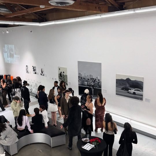 Art exhibition opening at 439 with crowd viewing works on gallery walls