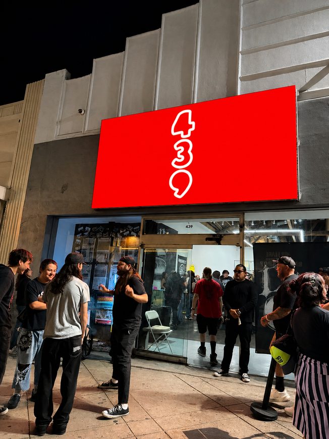 Night crowd outside 439 under the red marquee sign